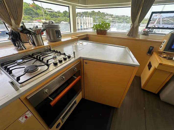  Yacht Photos Pics Modern kitchen in 2017 Lagoon 52 F yacht with stove, oven, and scenic windows.