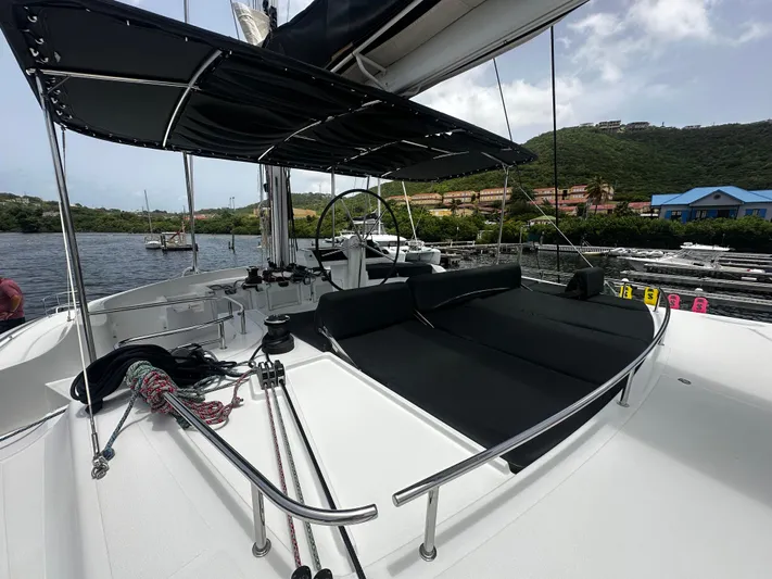  Yacht Photos Pics 2017 Lagoon 52 F catamaran with sleek deck design and scenic marina backdrop.