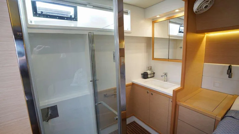  Yacht Photos Pics Modern bathroom interior of 2017 Lagoon 52 F yacht with shower and vanity.