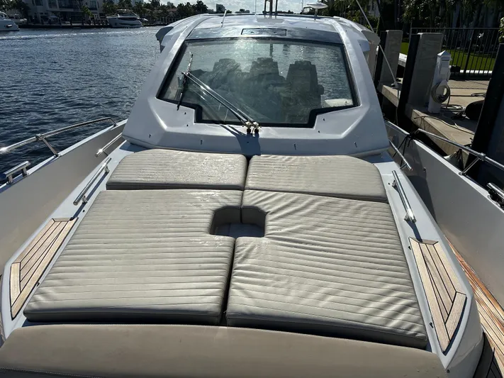  Yacht Photos Pics 2018 Azimut Verve 40 yacht with sunbathing deck, docked by the water.