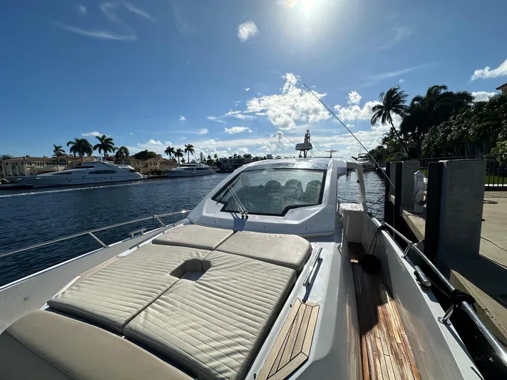  Yacht Photos Pics 2018 Azimut Verve 40 yacht docked under sunny skies, with palm trees and waterway views.