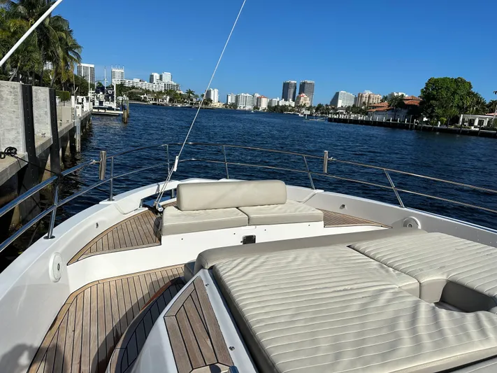  Yacht Photos Pics 2018 Azimut Verve 40 yacht on a sunny waterfront, showcasing luxury deck and seating.