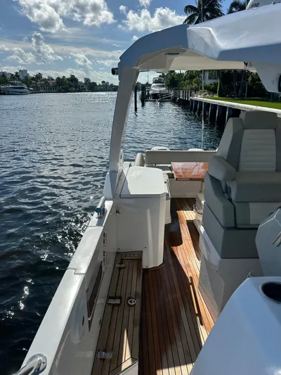  Yacht Photos Pics 2018 Azimut Verve 40 yacht with sleek deck, cruising on a sunny waterfront.