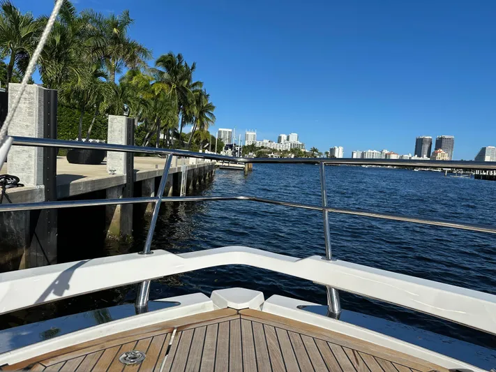  Yacht Photos Pics Bow view from 2018 Azimut Verve 40 yacht, overlooking a sunny waterfront cityscape.
