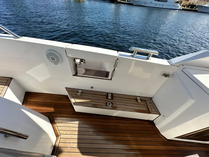  Yacht Photos Pics 2018 Azimut Verve 40 yacht deck with wooden flooring and water view.