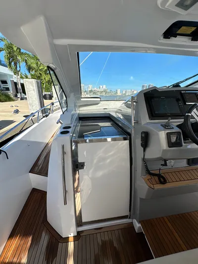  Yacht Photos Pics 2018 Azimut Verve 40 yacht cockpit with modern controls and wooden flooring.