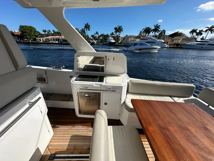  Yacht Photos Pics Luxurious 2018 Azimut Verve 40 yacht interior with outdoor kitchen and scenic waterfront view.