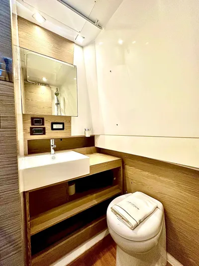  Yacht Photos Pics 2018 Azimut Verve 40 yacht bathroom with modern sink, mirror, and toilet.
