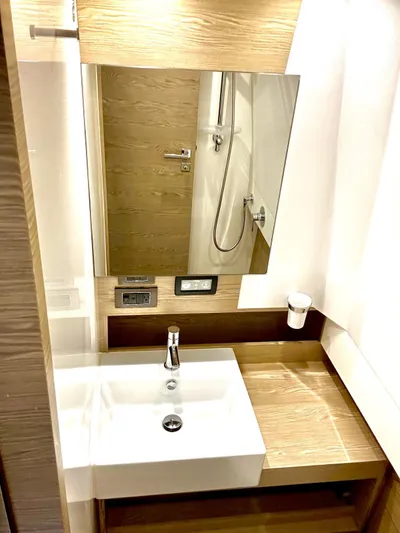  Yacht Photos Pics Modern bathroom interior on 2018 Azimut Verve 40 yacht, featuring sleek sink and mirror.