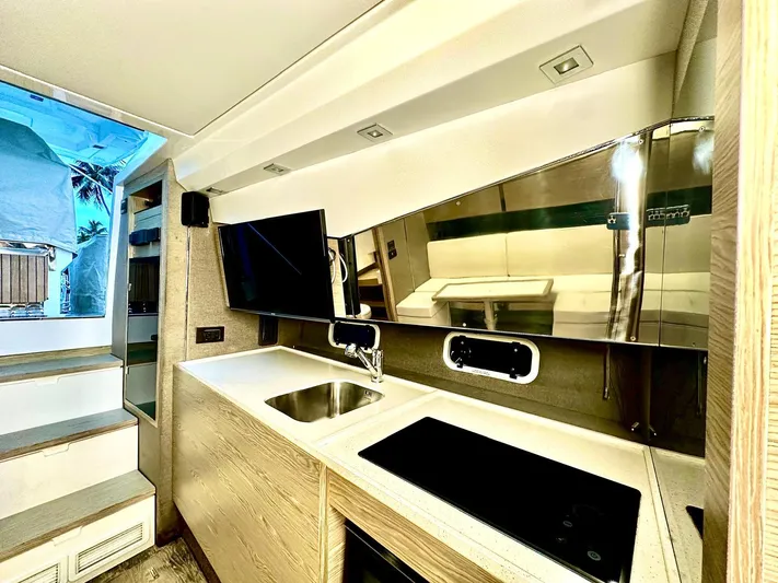  Yacht Photos Pics Modern kitchen interior of 2018 Azimut Verve 40 yacht with sleek design and amenities.