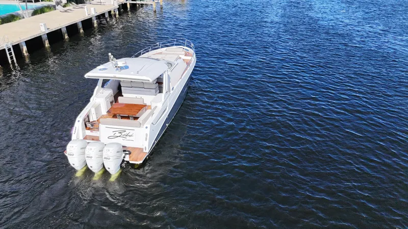  Yacht Photos Pics 2018 Azimut Verve 40 yacht cruising on open water, rear view.