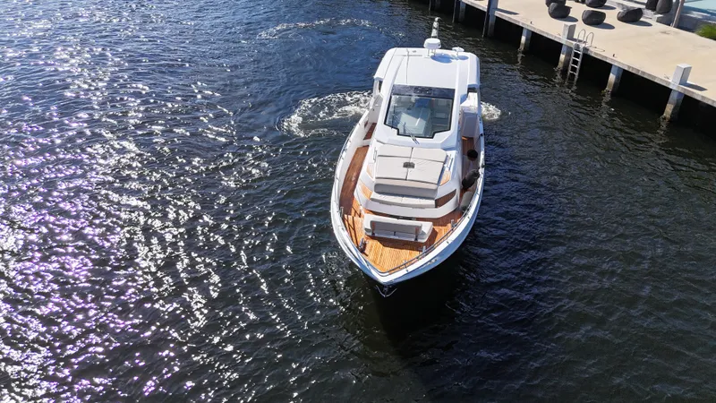  Yacht Photos Pics 2018 Azimut Verve 40 yacht cruising near a dock on a sunny day.
