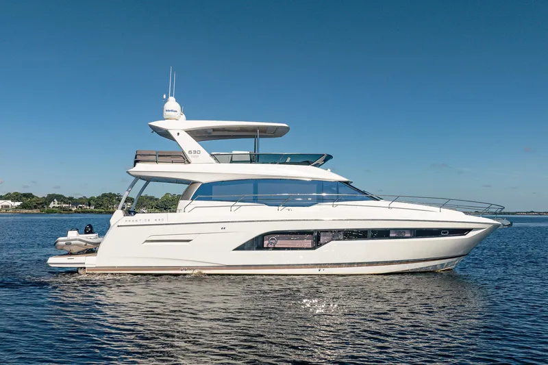 No Rush Yacht Photos Pics 2018 Prestige 630 yacht cruising on calm waters under clear blue sky.