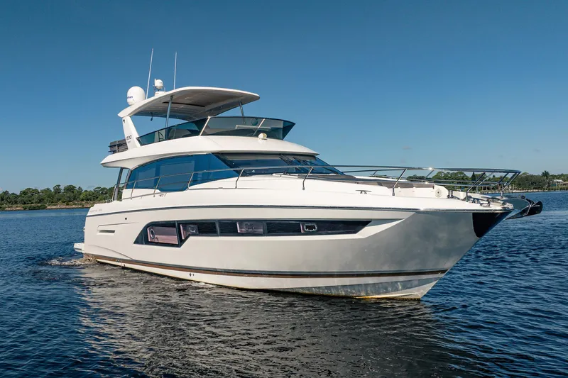 No Rush Yacht Photos Pics 2018 Prestige 630 yacht cruising on calm waters under clear blue skies.