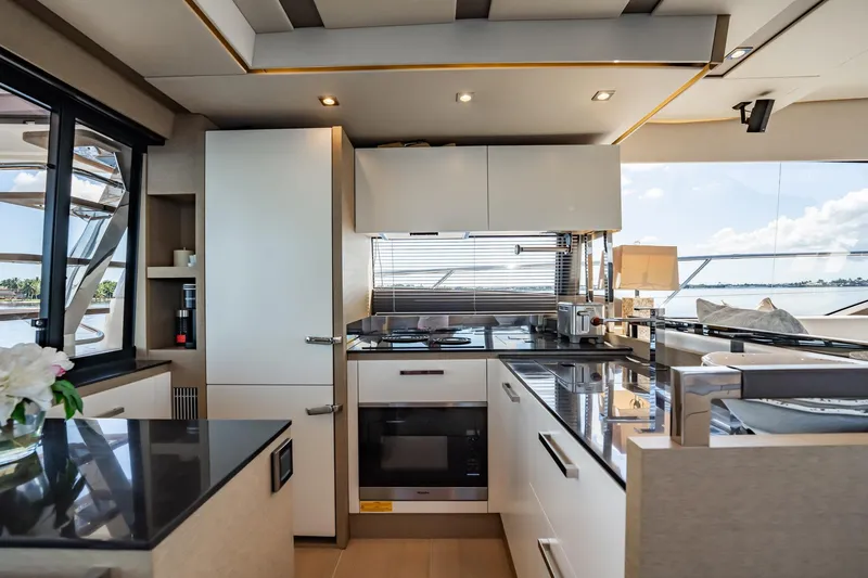 No Rush Yacht Photos Pics Luxurious kitchen interior on a 2018 Prestige 630 yacht, featuring modern appliances and sleek design.