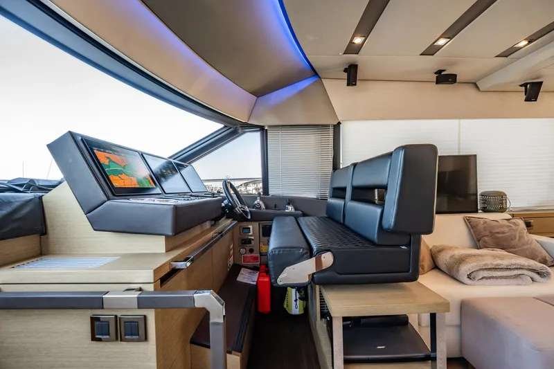 No Rush Yacht Photos Pics Luxurious interior of 2018 Prestige 630 yacht with modern helm and seating area.