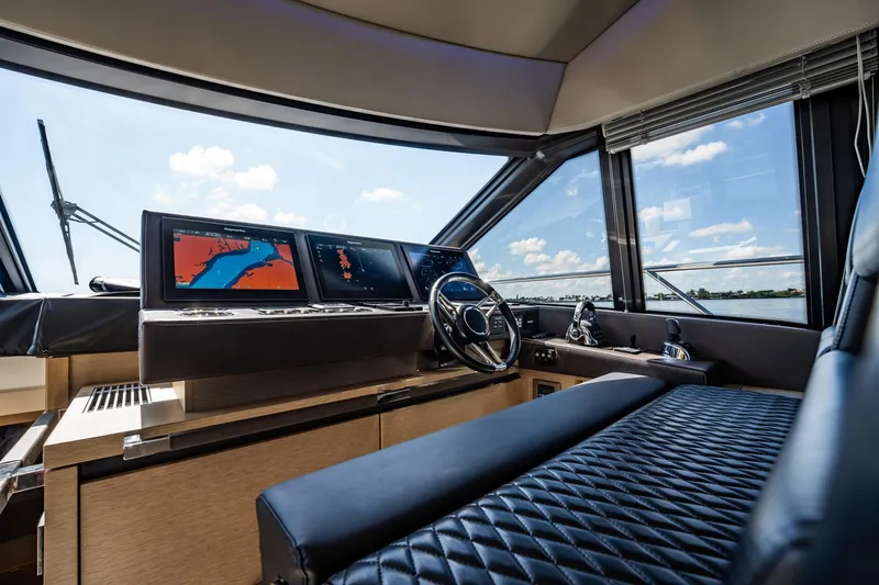 No Rush Yacht Photos Pics Luxurious interior of 2018 Prestige 630 yacht with modern navigation system and panoramic windows.