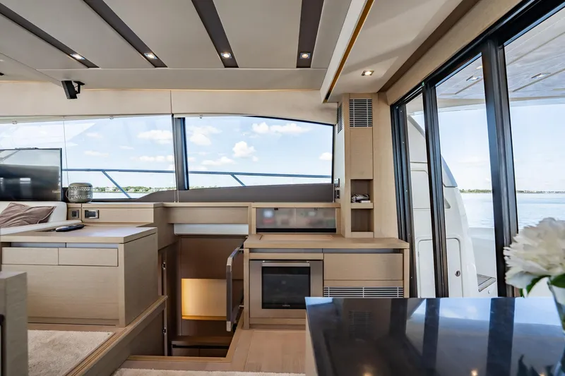 No Rush Yacht Photos Pics Luxurious interior of 2018 Prestige 630 yacht with modern kitchen and panoramic windows.