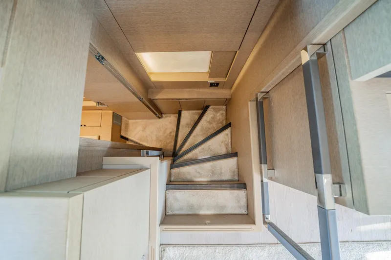 No Rush Yacht Photos Pics Staircase inside 2018 Prestige 630 yacht, featuring modern design and sleek finishes.