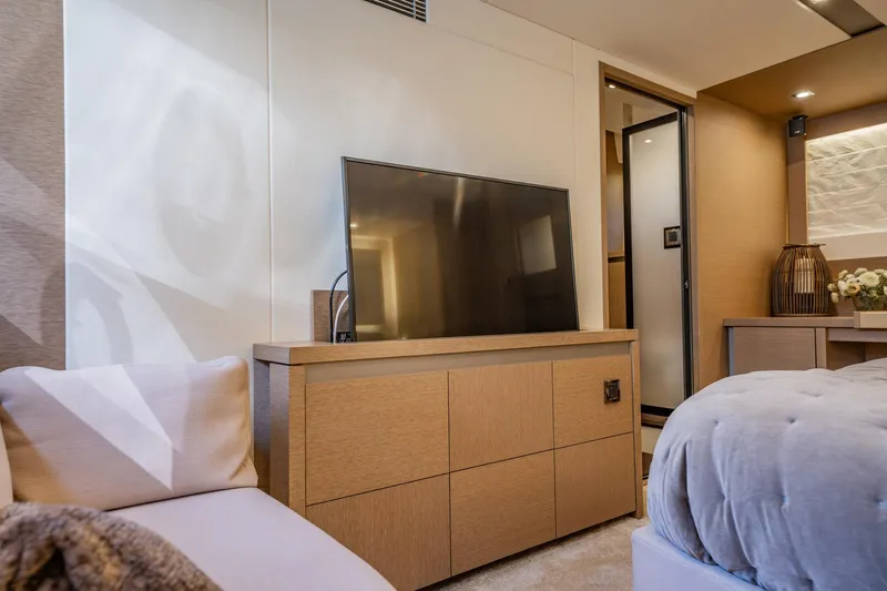 No Rush Yacht Photos Pics Luxurious interior of 2018 Prestige 630 yacht with modern TV and elegant furnishings.