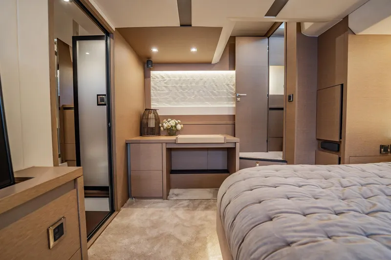 No Rush Yacht Photos Pics Luxurious interior of 2018 Prestige 630 yacht, featuring elegant bedroom and modern design elements.