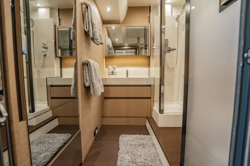 No Rush Yacht Photos Pics Luxurious bathroom interior of 2018 Prestige 630 yacht with modern fixtures and elegant design.