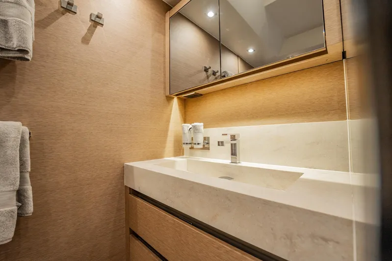 No Rush Yacht Photos Pics Luxurious bathroom interior on a 2018 Prestige 630 yacht, featuring modern fixtures and elegant design.