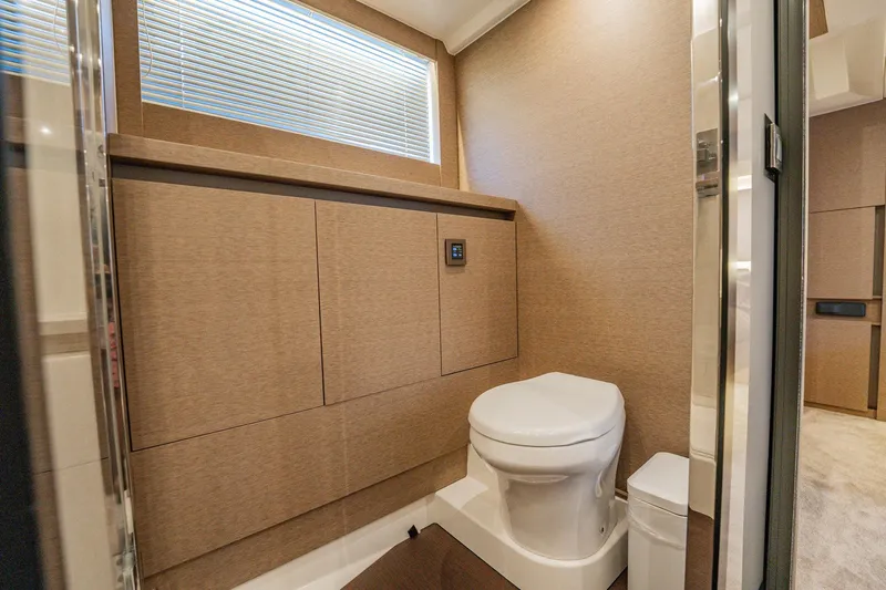 No Rush Yacht Photos Pics Luxurious bathroom interior of 2018 Prestige 630 yacht with modern design and amenities.