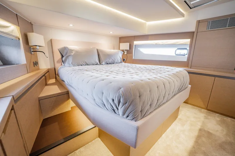 No Rush Yacht Photos Pics Luxurious bedroom interior of 2018 Prestige 630 yacht with modern design and cozy bedding.
