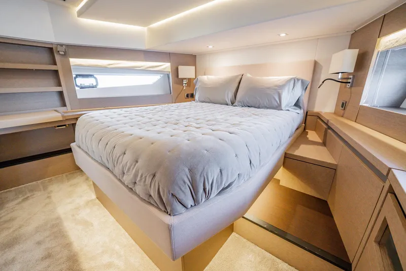 No Rush Yacht Photos Pics Luxurious bedroom interior of 2018 Prestige 630 yacht with modern design and cozy bedding.
