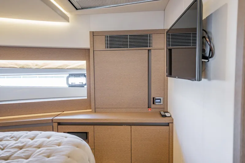 No Rush Yacht Photos Pics Luxurious interior of 2018 Prestige 630 yacht with modern cabinetry and wall-mounted TV.