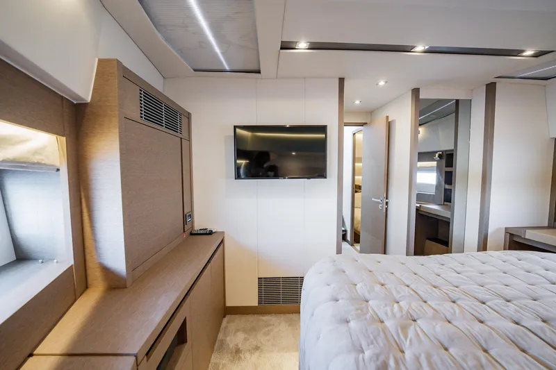 No Rush Yacht Photos Pics Luxurious interior of 2018 Prestige 630 yacht with modern bedroom and TV.