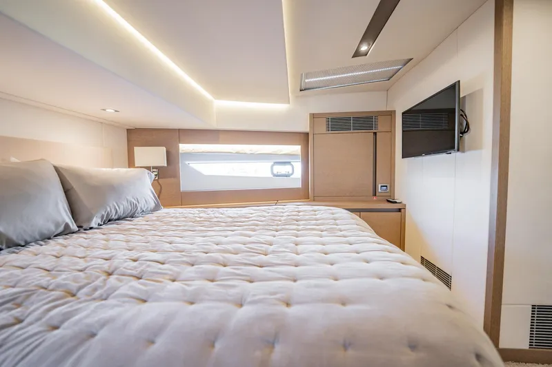No Rush Yacht Photos Pics Luxurious bedroom interior of 2018 Prestige 630 yacht with modern design and cozy bedding.