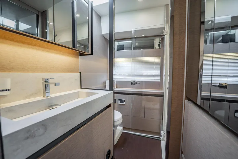 No Rush Yacht Photos Pics Luxurious bathroom interior of 2018 Prestige 630 yacht with modern fixtures and elegant design.