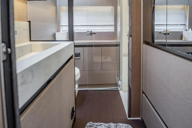 No Rush Yacht Photos Pics Luxurious bathroom interior of 2018 Prestige 630 yacht with modern fixtures and elegant design.