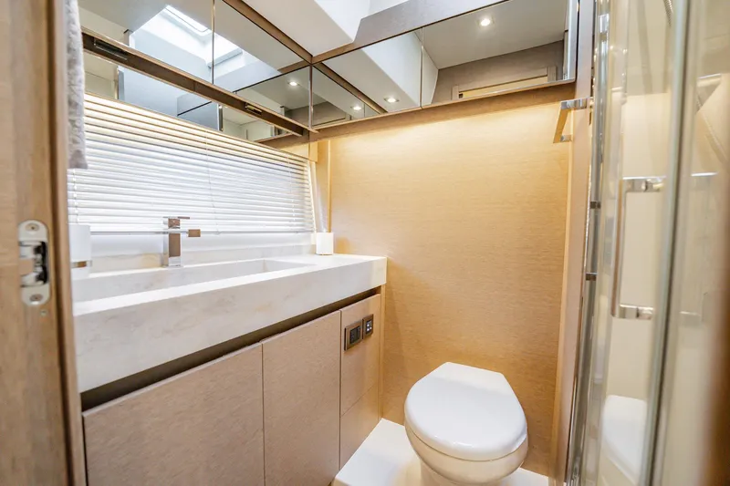 No Rush Yacht Photos Pics Luxurious bathroom interior of 2018 Prestige 630 yacht with modern fixtures and elegant design.