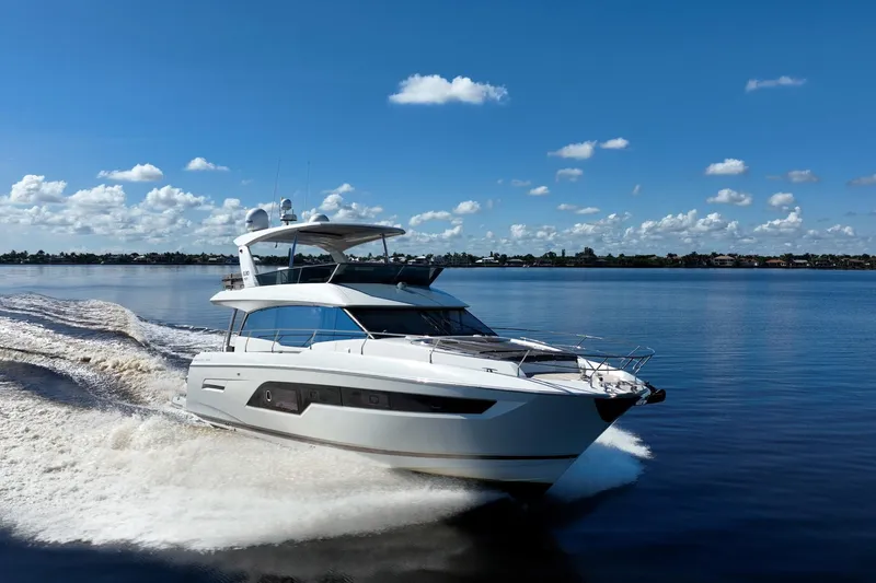 No Rush Yacht Photos Pics Luxurious 2018 Prestige 630 yacht cruising on a serene, sunny day.