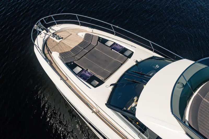 No Rush Yacht Photos Pics Aerial view of 2018 Prestige 630 yacht with sunbathing area on deck.