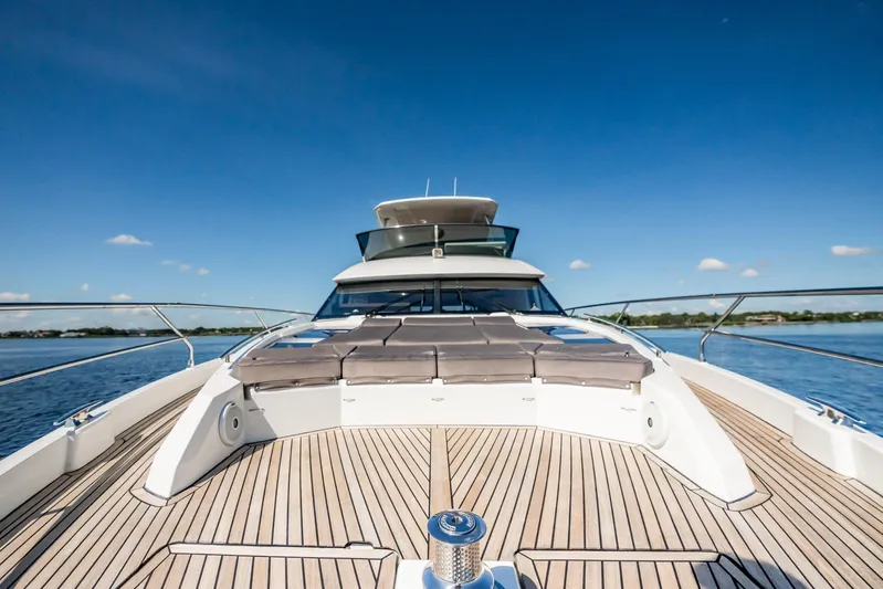 No Rush Yacht Photos Pics 2018 Prestige 630 yacht deck with sun loungers, cruising on a clear blue day.