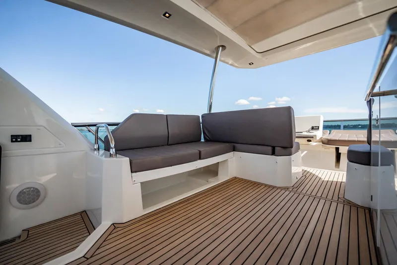 No Rush Yacht Photos Pics Spacious deck area on 2018 Prestige 630 yacht with comfortable seating and ocean view.