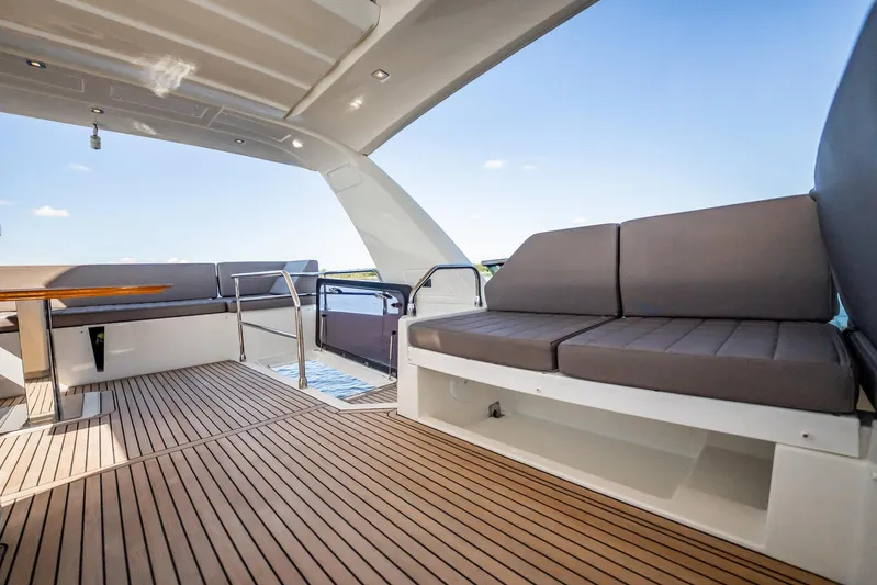 No Rush Yacht Photos Pics Luxurious 2018 Prestige 630 yacht interior with sleek seating and elegant wood flooring.