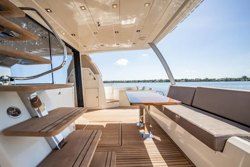 No Rush Yacht Photos Pics Luxurious 2018 Prestige 630 yacht interior with elegant seating and scenic water view.