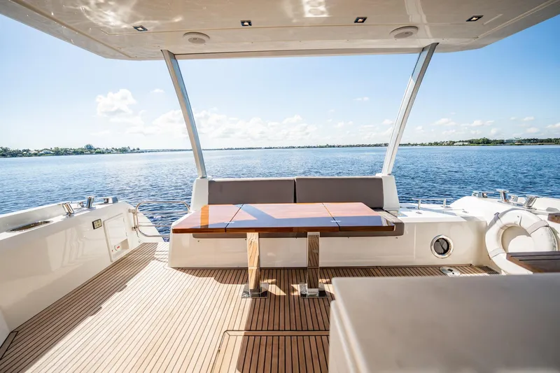 No Rush Yacht Photos Pics Luxurious 2018 Prestige 630 yacht deck with elegant seating and scenic water view.