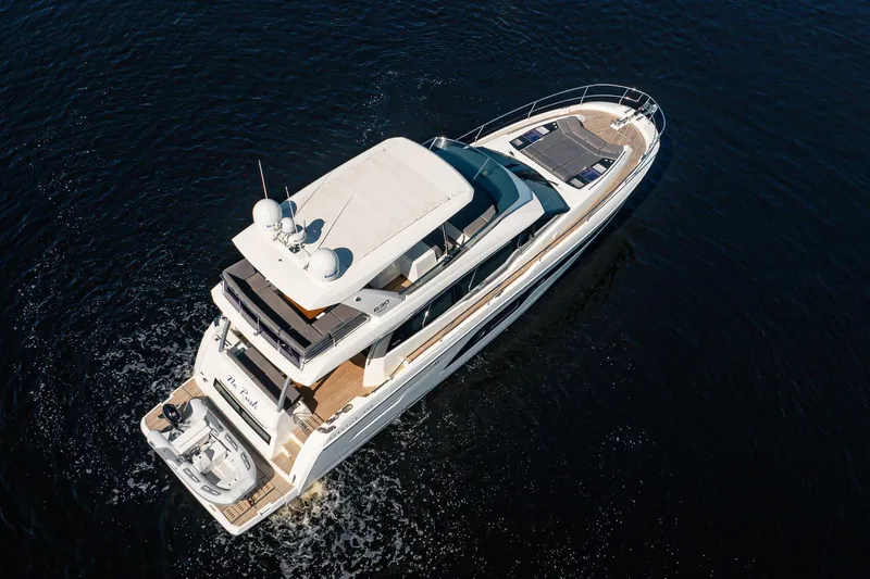 No Rush Yacht Photos Pics Aerial view of 2018 Prestige 630 yacht cruising on open water.
