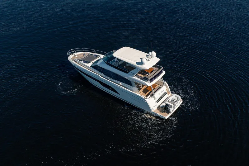 No Rush Yacht Photos Pics Luxurious 2018 Prestige 630 yacht cruising on calm, deep blue waters.