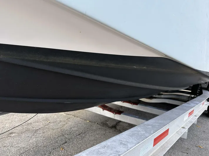  Yacht Photos Pics 2022 Sea Fox 288 Commander boat hull on a trailer, close-up view.
