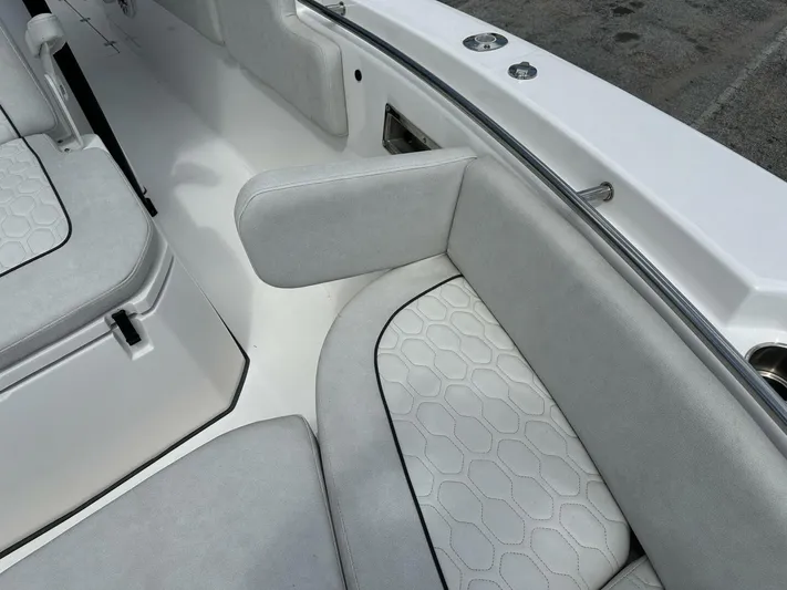  Yacht Photos Pics 2022 Sea Fox 288 Commander boat interior with cushioned seating and armrest detail.