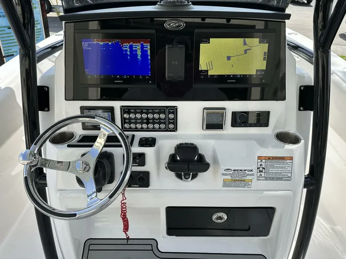  Yacht Photos Pics 2022 Sea Fox 288 Commander boat dashboard with navigation screens and controls.