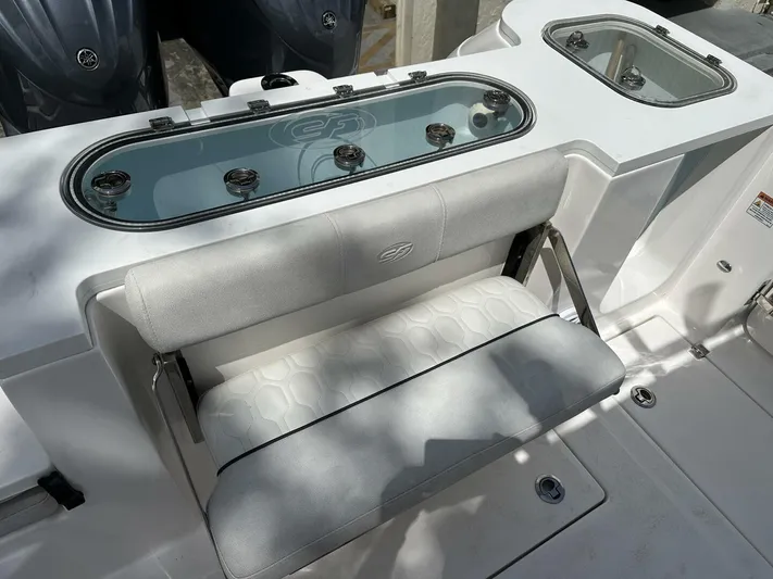  Yacht Photos Pics 2022 Sea Fox 288 Commander boat seating and livewell area, featuring sleek design and functionality.