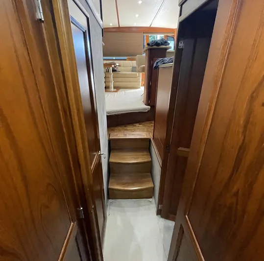 On Course Yacht Photos Pics Interior of 1986 Egg Harbor 41 Convertible yacht with wooden stairs and cozy cabin.